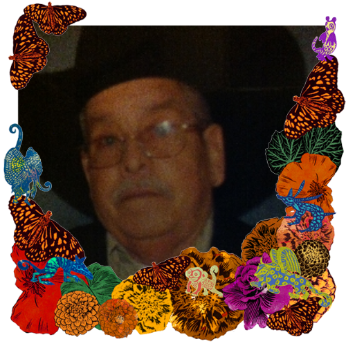 Photo of Ruben Avalos in a frame with marigolds, flowers, alebrijes and monarch butterflies.