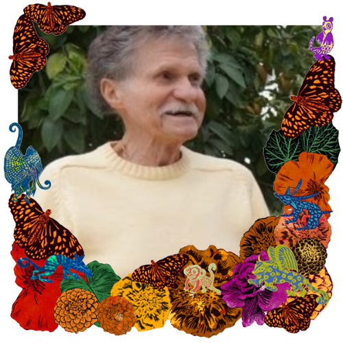 Photo of Ruben Poplawski in a frame with marigolds, flowers, alebrijes and monarch butterflies.
