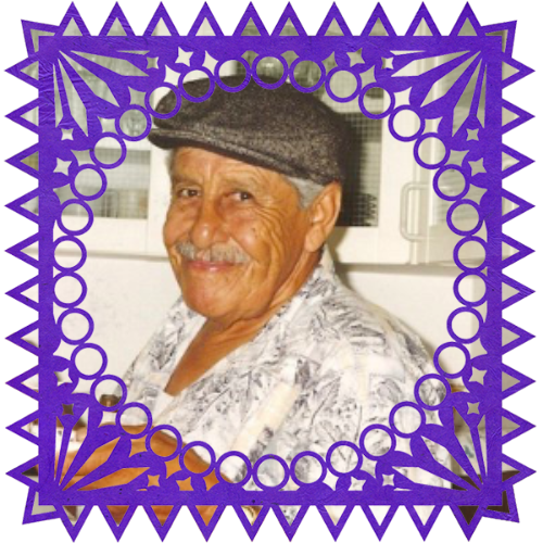Photo of Rudy De La Loza in a frame with papel picado.