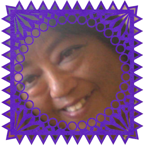 Photo of Ruthie in a frame with papel picado.