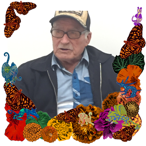Photo of Salvador Arellano in a frame with marigolds, flowers, alebrijes and monarch butterflies.