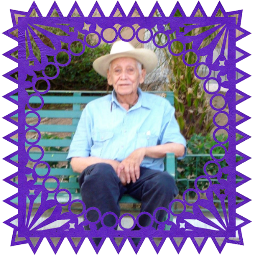 Photo of Salvador Mena in a frame with papel picado.