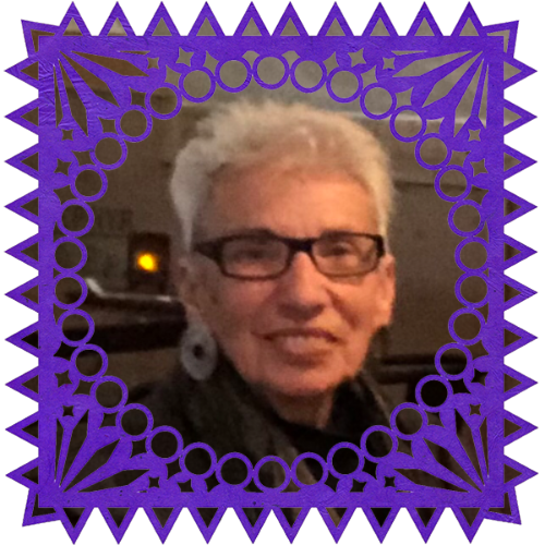 Photo of Sondra Alexander in a frame with papel picado.