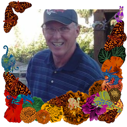 Photo of Stanley Robert Perry in a frame with marigolds, flowers, alebrijes and monarch butterflies.