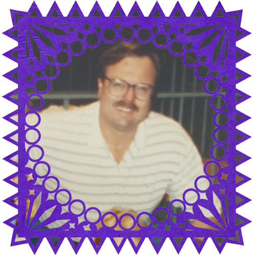 Photo of Steve Heber in a frame with papel picado.