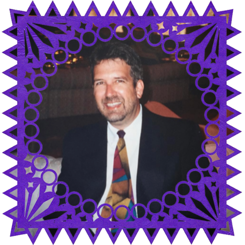 Photo of Steve Jeffers in a frame with papel picado.