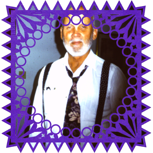 Photo of Theodore in a frame with papel picado.