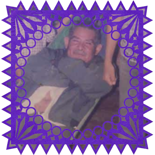 Photo of Tomás García in a frame with papel picado.