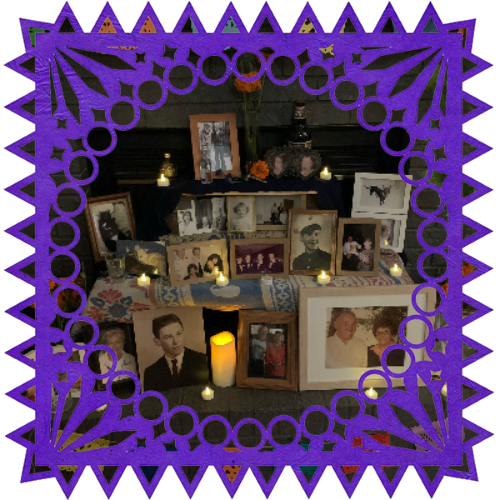Photo of Too many family members in a frame with papel picado.