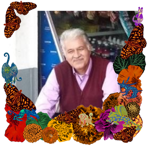 Photo of Victor in a frame with marigolds, flowers, alebrijes and monarch butterflies.
