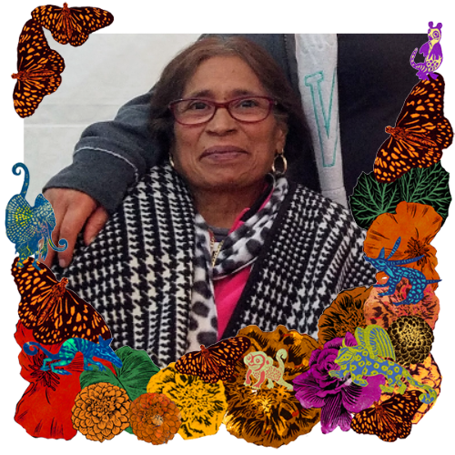 Photo of Victoria Flores in a frame with marigolds, flowers, alebrijes and monarch butterflies.