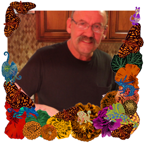 Photo of Zigifredo Hernandez in a frame with marigolds, flowers, alebrijes and monarch butterflies.