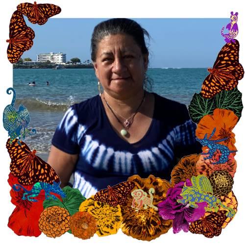 Photo of Zoila Pauta in a frame with marigolds, flowers, alebrijes and monarch butterflies.