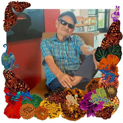 Photo of Eugenio "El abuelo" Rodríguez in a frame with marigolds, flowers, alebrijes and monarch butterflies.