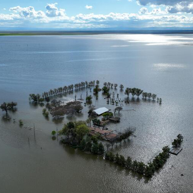 An aerial view of the Hansen family farm submerged beneath a reborn Tulare Lake. 