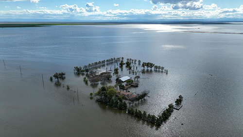 An aerial view of the Hansen family farm submerged beneath a reborn Tulare Lake.