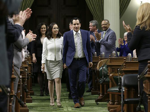 Anthony Rendon and Annie Lam walk down the center aisle of the Assembly.