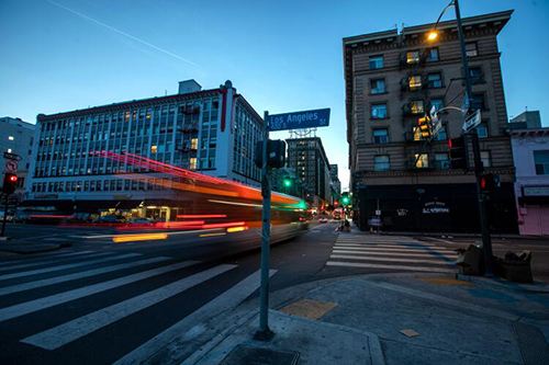 In the evening a bus travels between the Baltimore Hotel, left, and the King Edward Hotel, in Los Angeles.