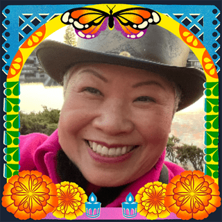 Photo of Aunt Kat in an illustrated frame of blue and green papel picado, with a monarch butterfly, marigold flowers and candles.