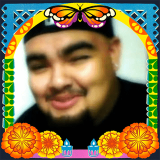 Photo of Steven Salas in an illustrated frame of blue and green papel picado, with a monarch butterfly, marigold flowers and candles.