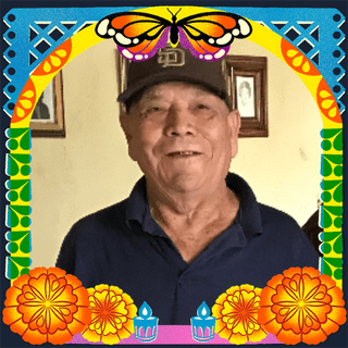 Photo of Rafael Cazares in an illustrated frame of blue and green papel picado, with a monarch butterfly, marigold flowers and candles.