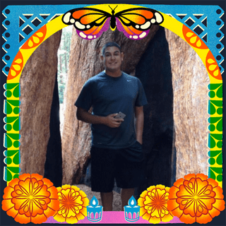 Photo of Rudy Fuentes in an illustrated frame of blue and green papel picado, with a monarch butterfly, marigold flowers and candles.