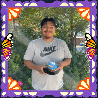 Photo of Uncle Isaac in an illustrated frame of purple papel picado, with monarch butterfly wings.