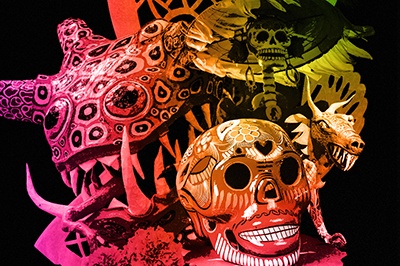 Photo illustration of a sugar skull, alebrije and catrina.