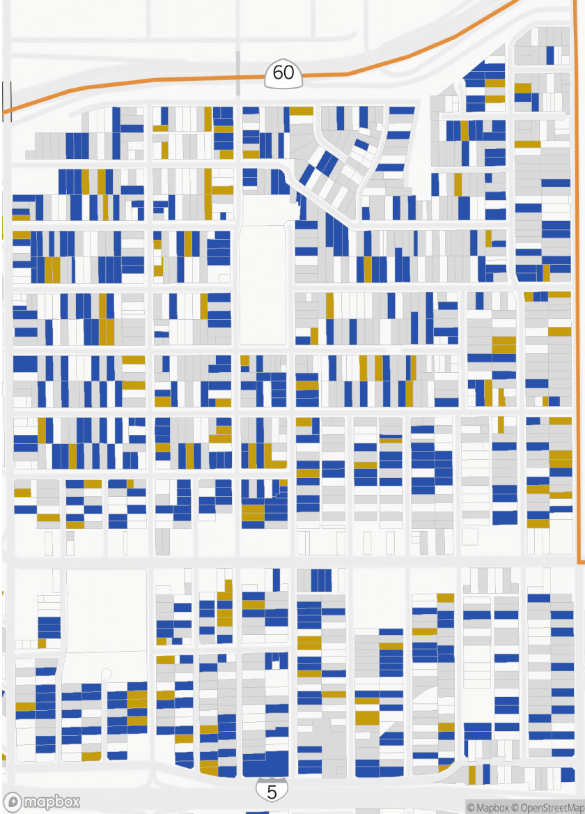 A map of several blocks of properties in East L.A., each colored by their DTSC cleanup status. There are a mix of homes that have been cleaned to standard, homes that have not been cleaned to standard, and homes that have not been cleaned at all or are missing data.