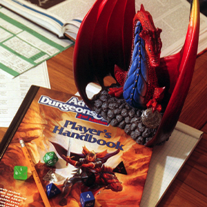 A Dungeons & Dragons gameboard and dice on a table