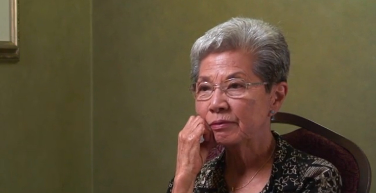 Portrait of Rose Tanaka listening to an interview question