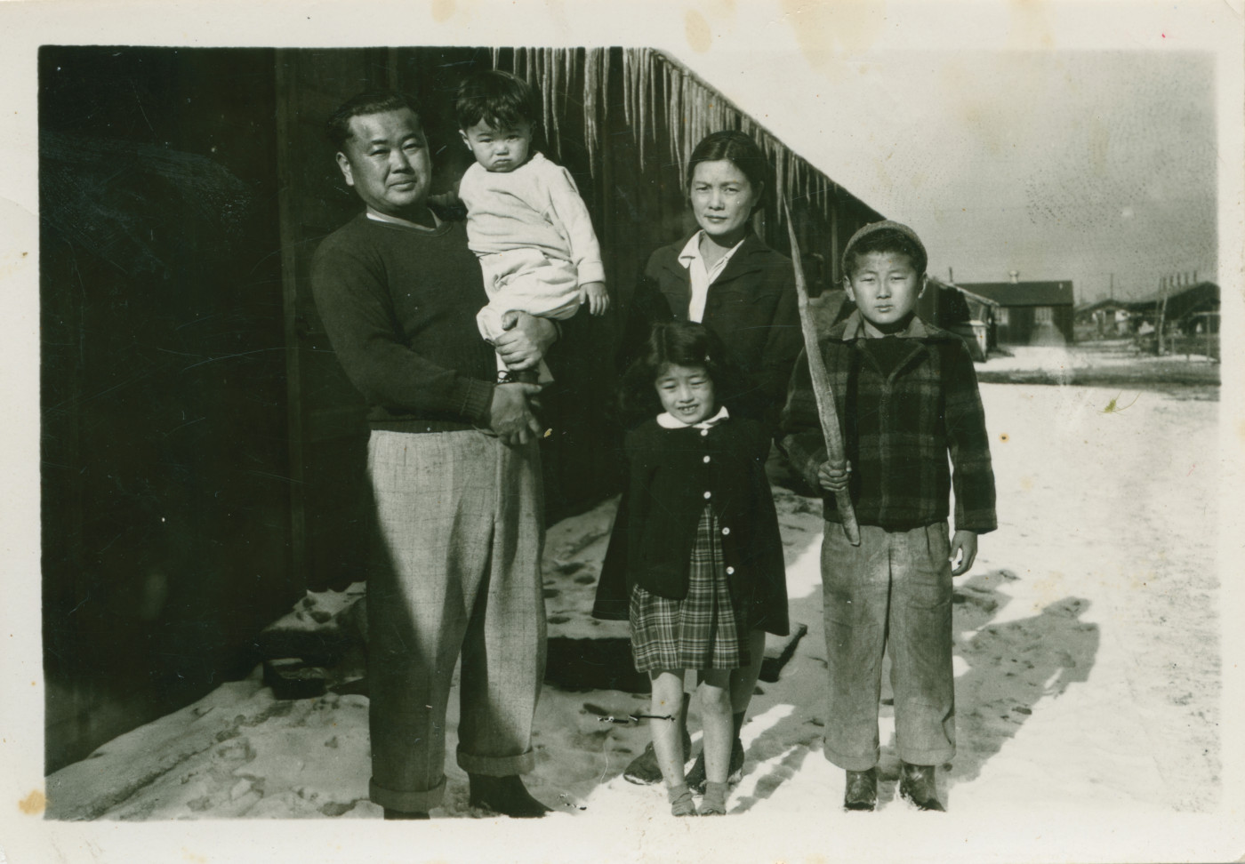 A picture of George Nakano with his parents and siblings posing for a photo at Tule Lake