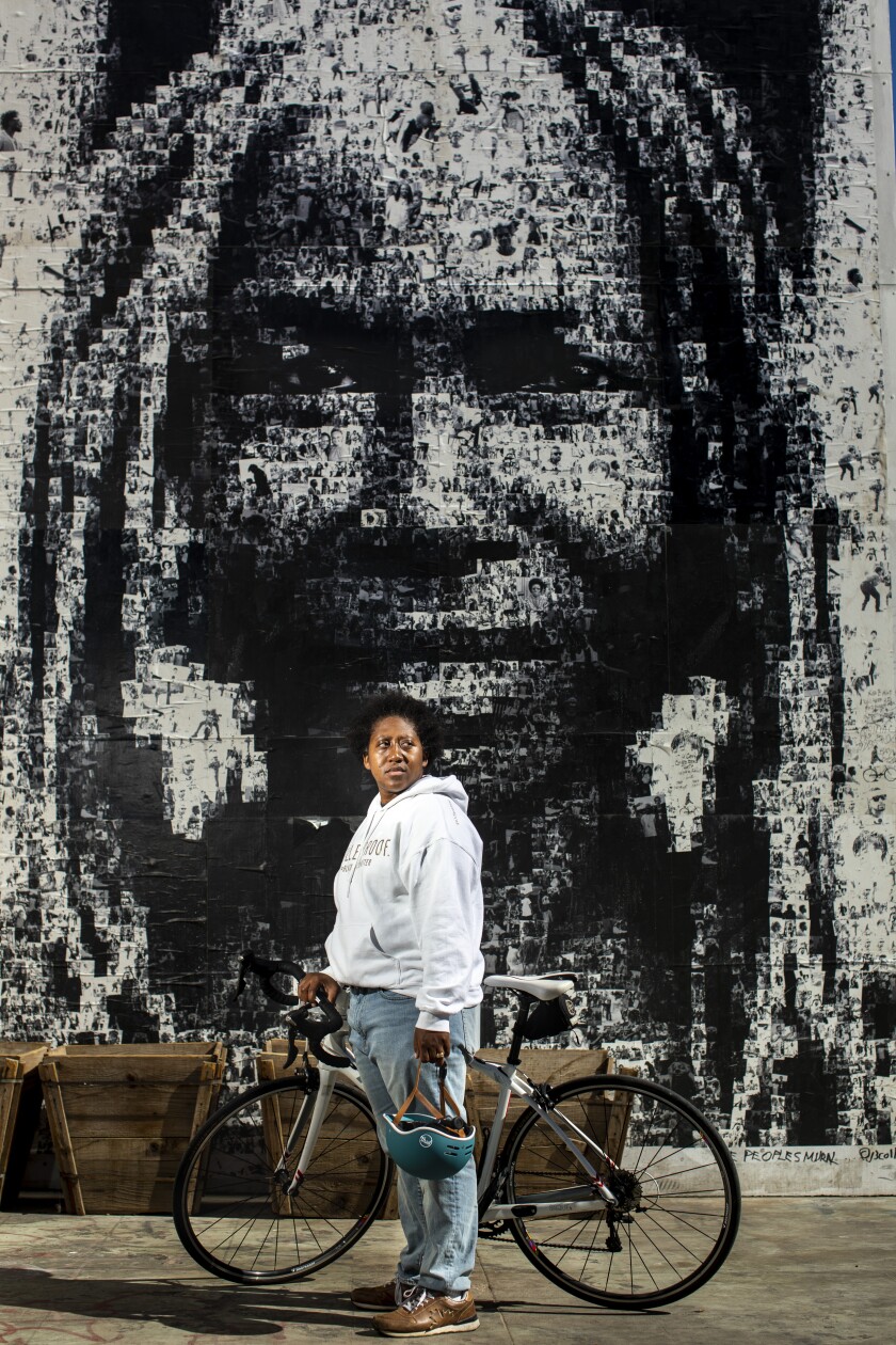 Tamika Butler, former head of the nonprofit Los Angeles County Bicycle Coalition, rides in Leimert Park.