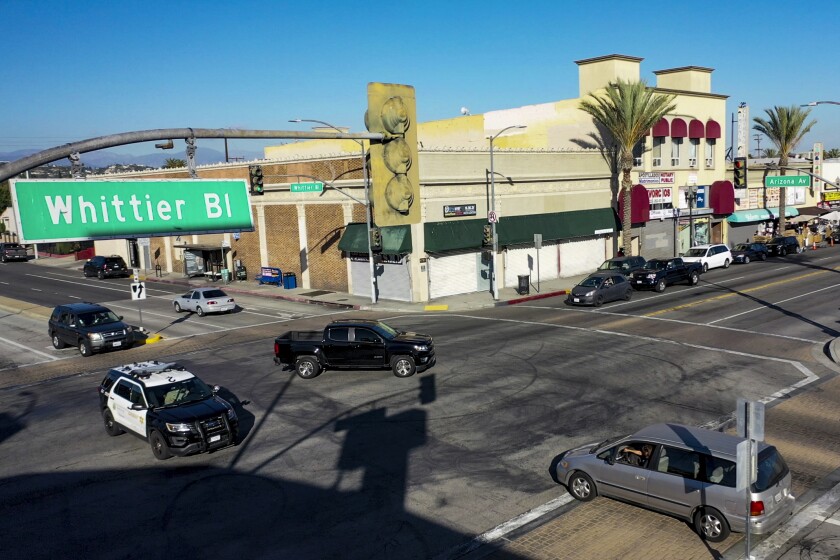 A Los Angeles County Sheriff's Department cruiser patrols Whittier Boulevard and Arizona Avenue in East Los Angeles.