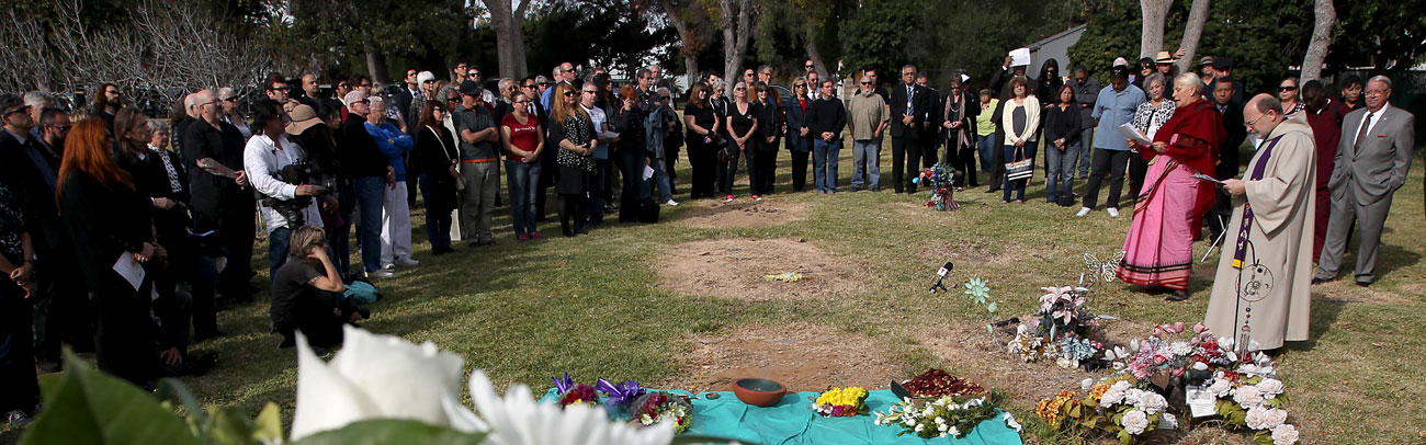 Mourners gather around the mass grave of those left unclaimed in Los Angeles County in 2015.