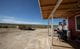 Brett Jones, right, gives his dad, Leonard, a haircut at their family home, which is located off a winding dirt road in a remote part of the Navajo Nation.