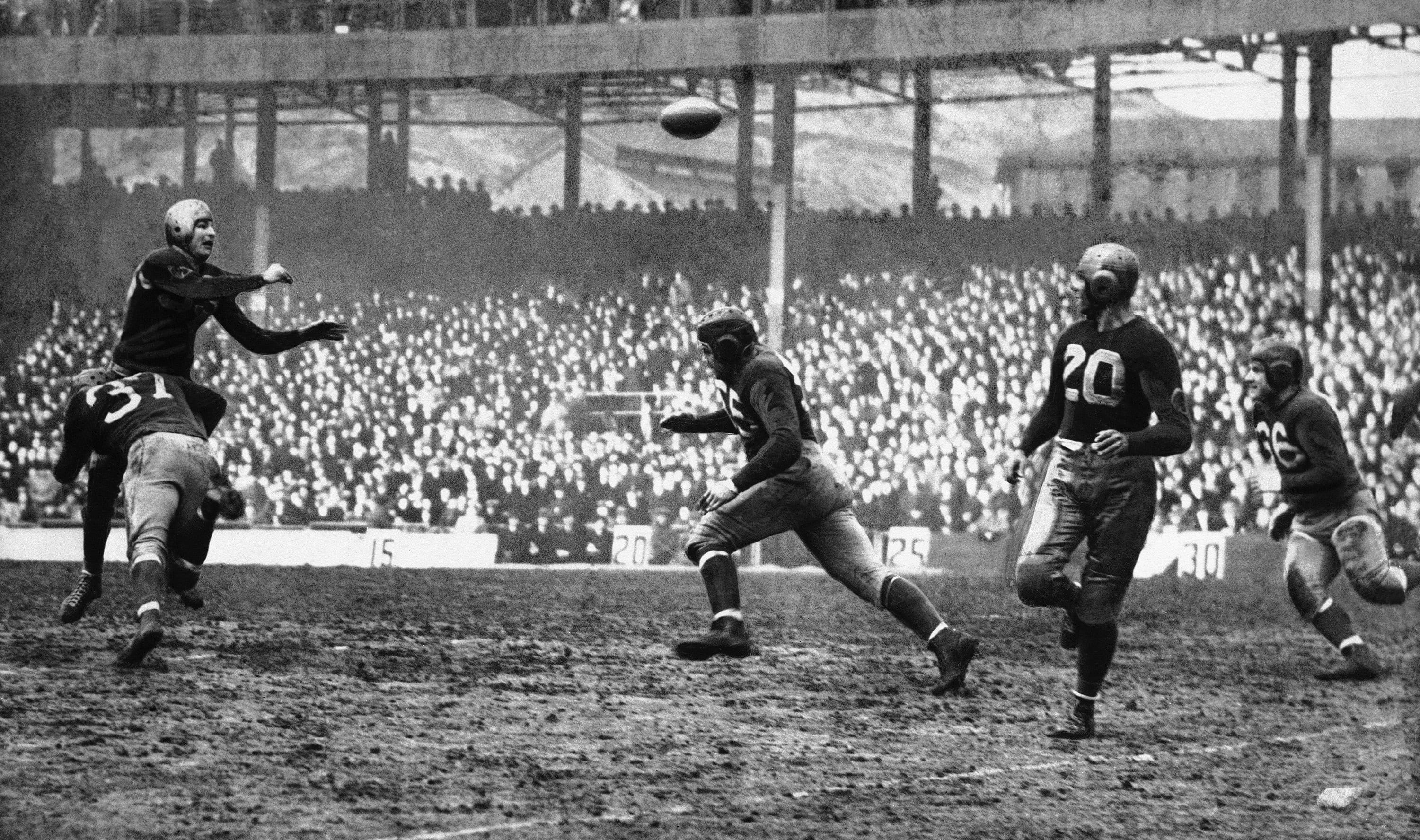 Sam Baugh of the Washington Redskins throws a pass during a game against the New York Giants in December 1937.