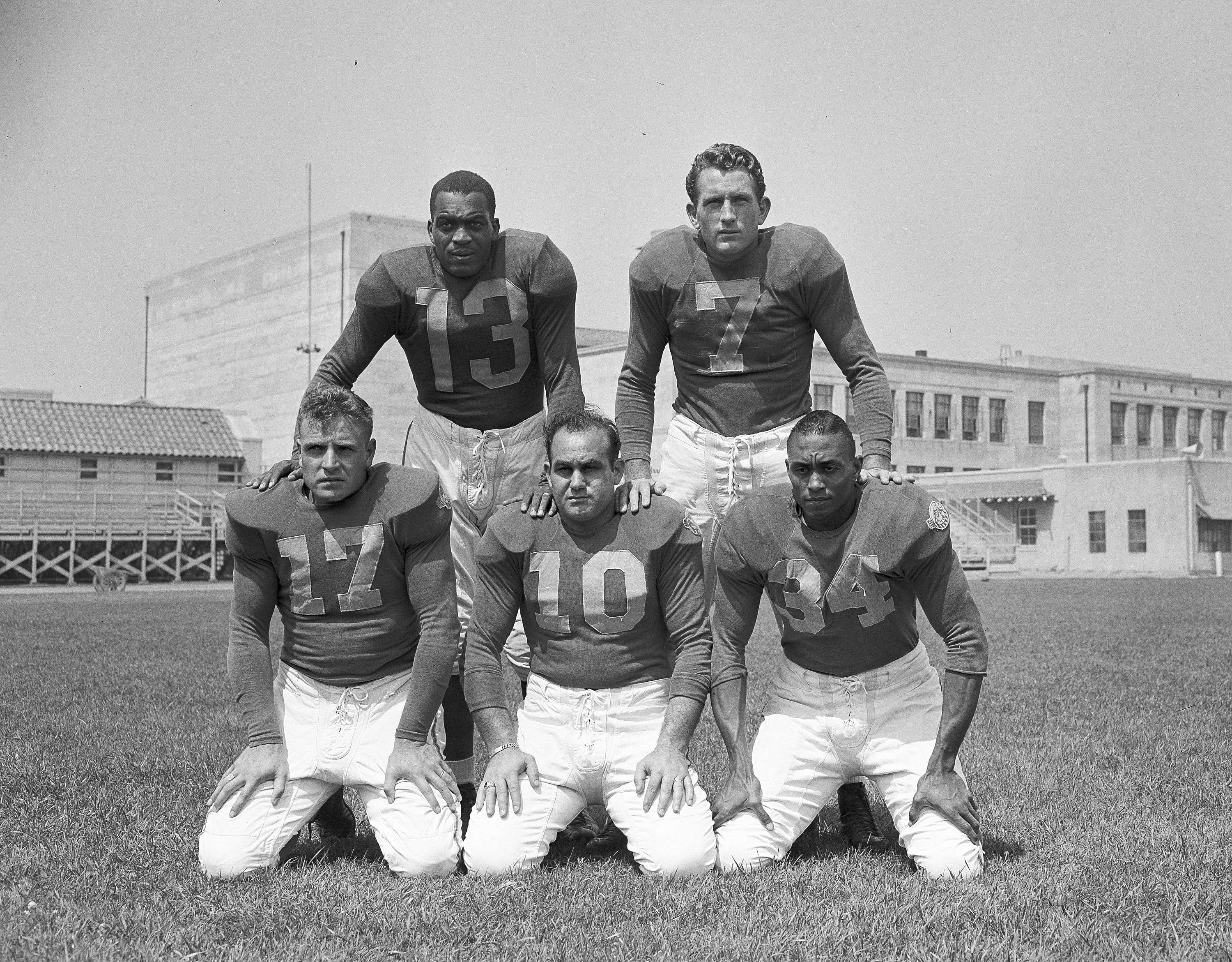 Former UCLA teammates (back row) Kenny Washington, Bob Waterfield, (bottom row) Jack Finlay, Nate de Francisco and Woody Strobe at Los Angeles Rams camp in Compton in 1946.