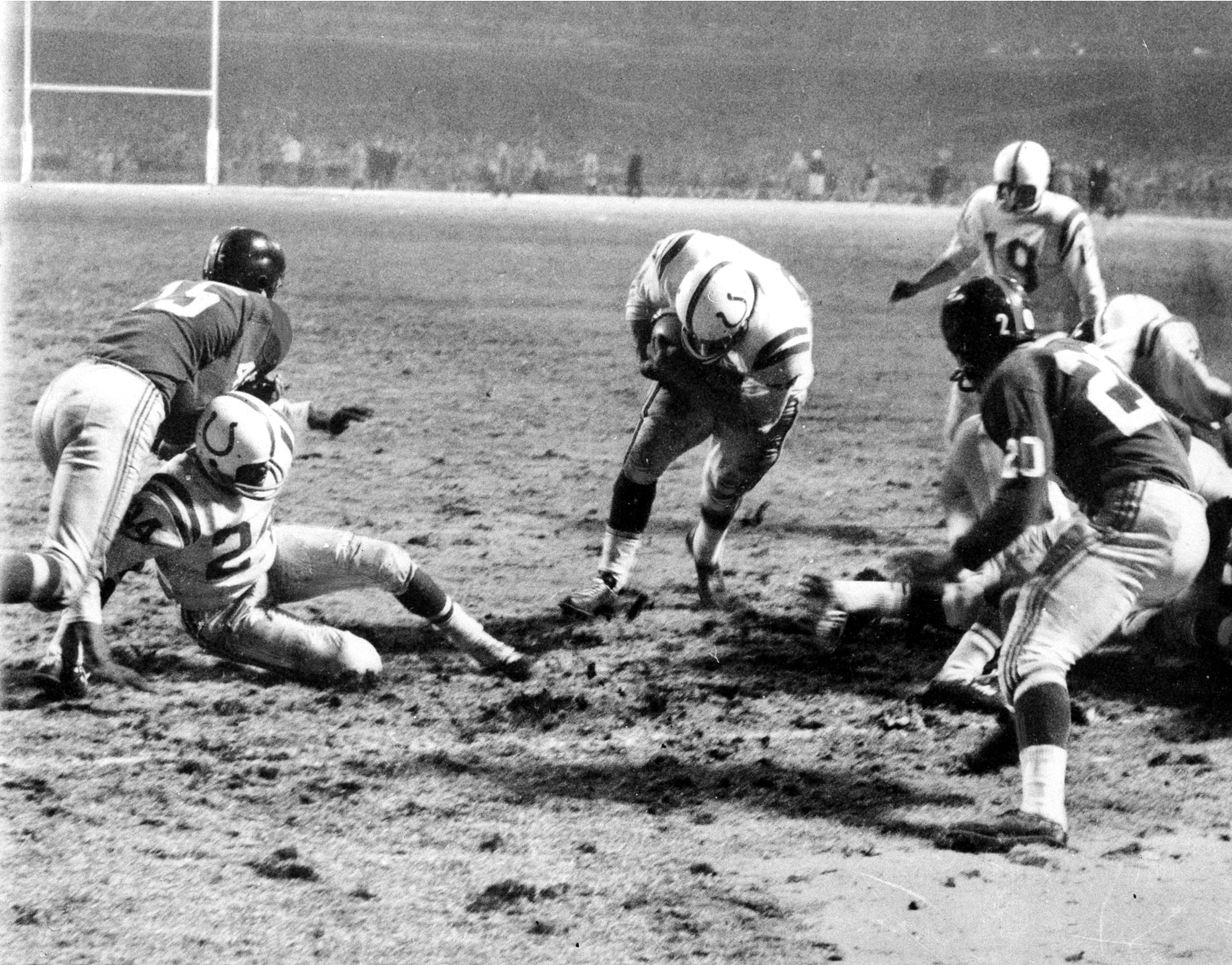 Baltimore Colts fullback Alan Ameche scores a touchdown against the New York Giants in overtime during the 1958 NFL championship game at Yankee Stadium.