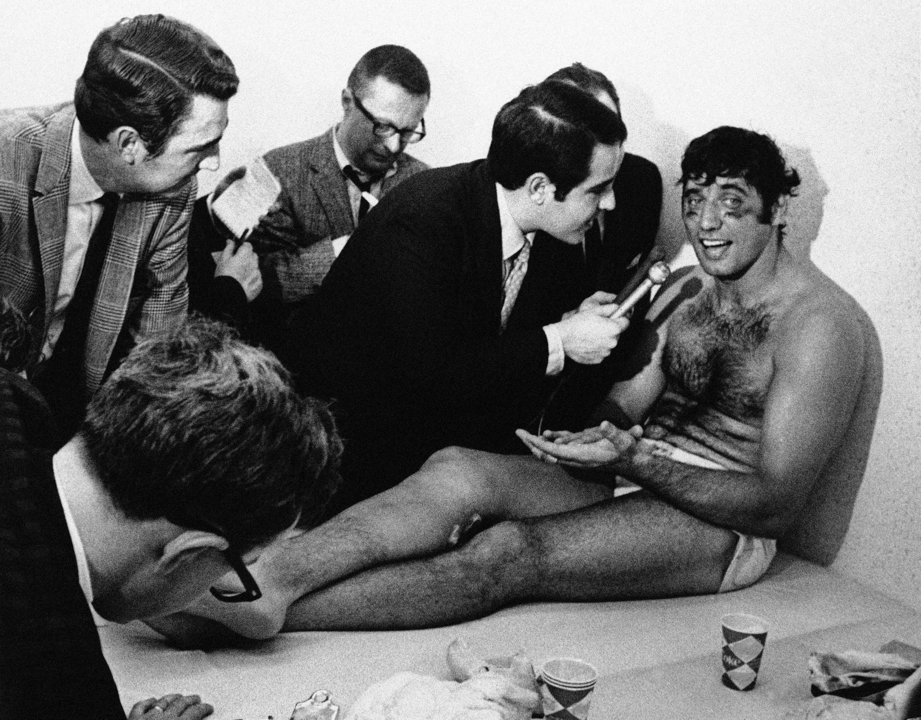 New York Jets quarterback Joe Namath speaks to reporters the day after beating the Baltimore Colts in Super Bowl III.
