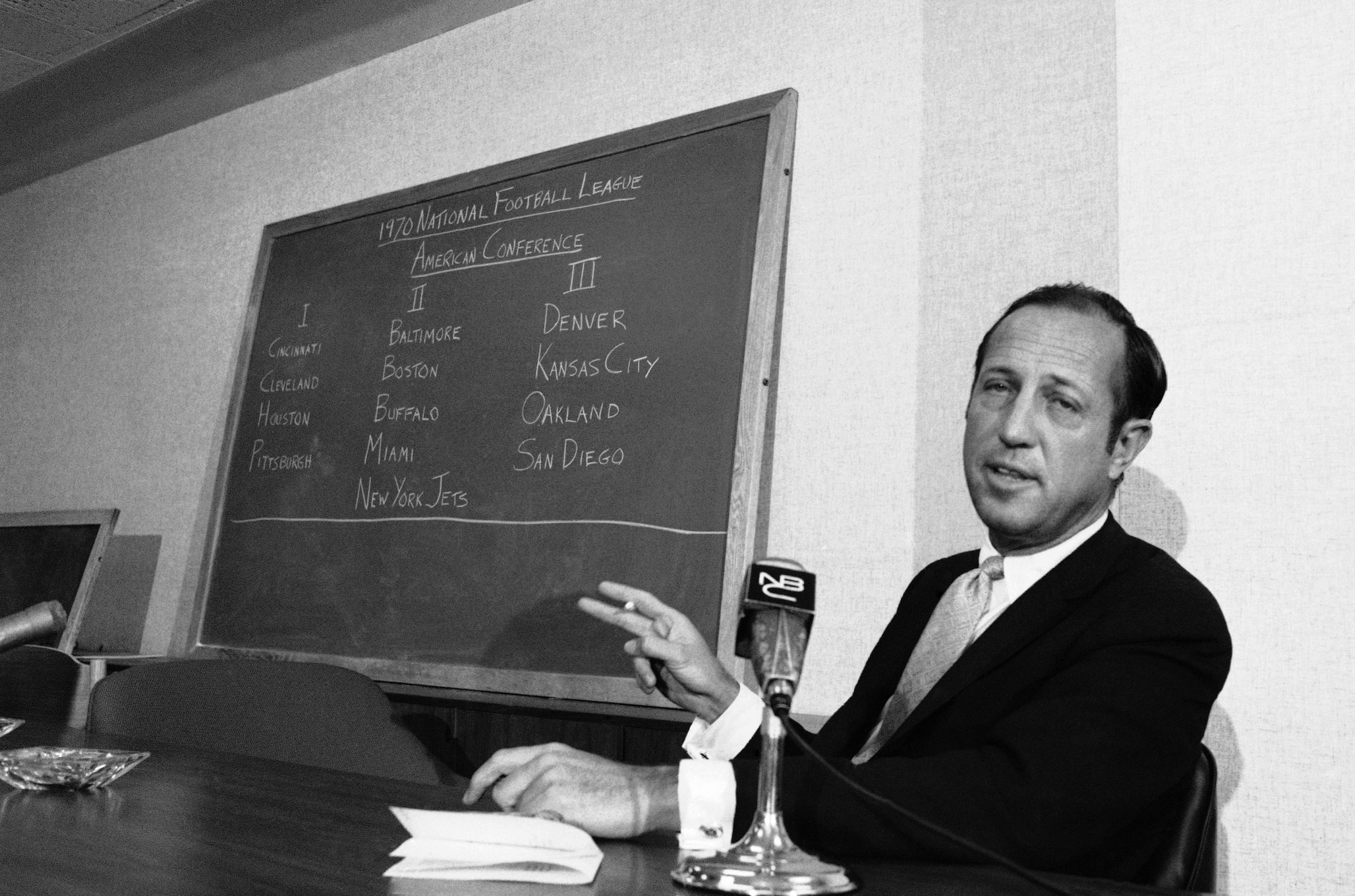 Speaking at a news conference in 1969, NFL commissioner Pete Rozelle discusses team alignment under the NFL-AFL merger.