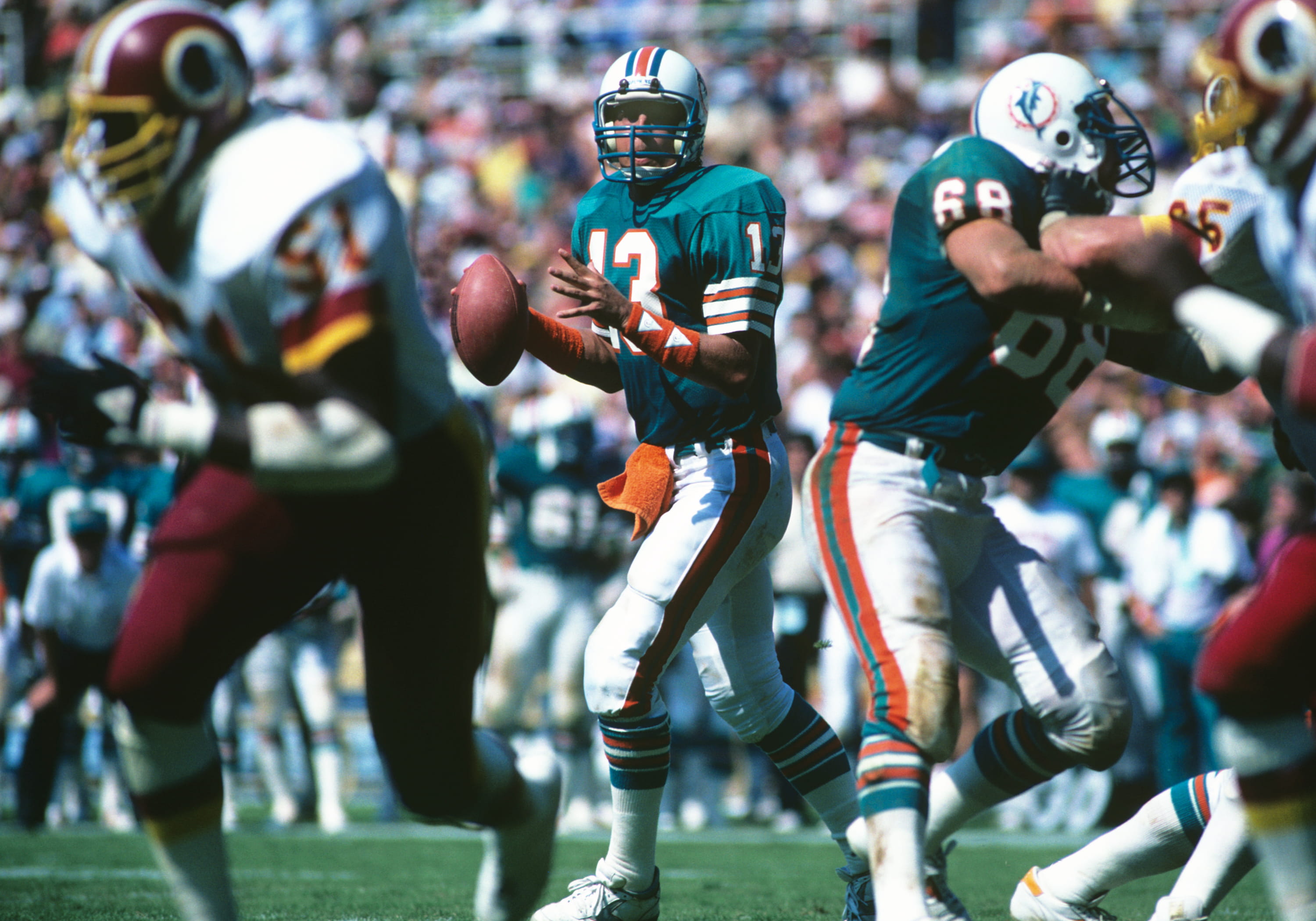 Miami Dolphins quarterback Dan Marino looks to pass during a game against the Washington Redskins in 1984.
