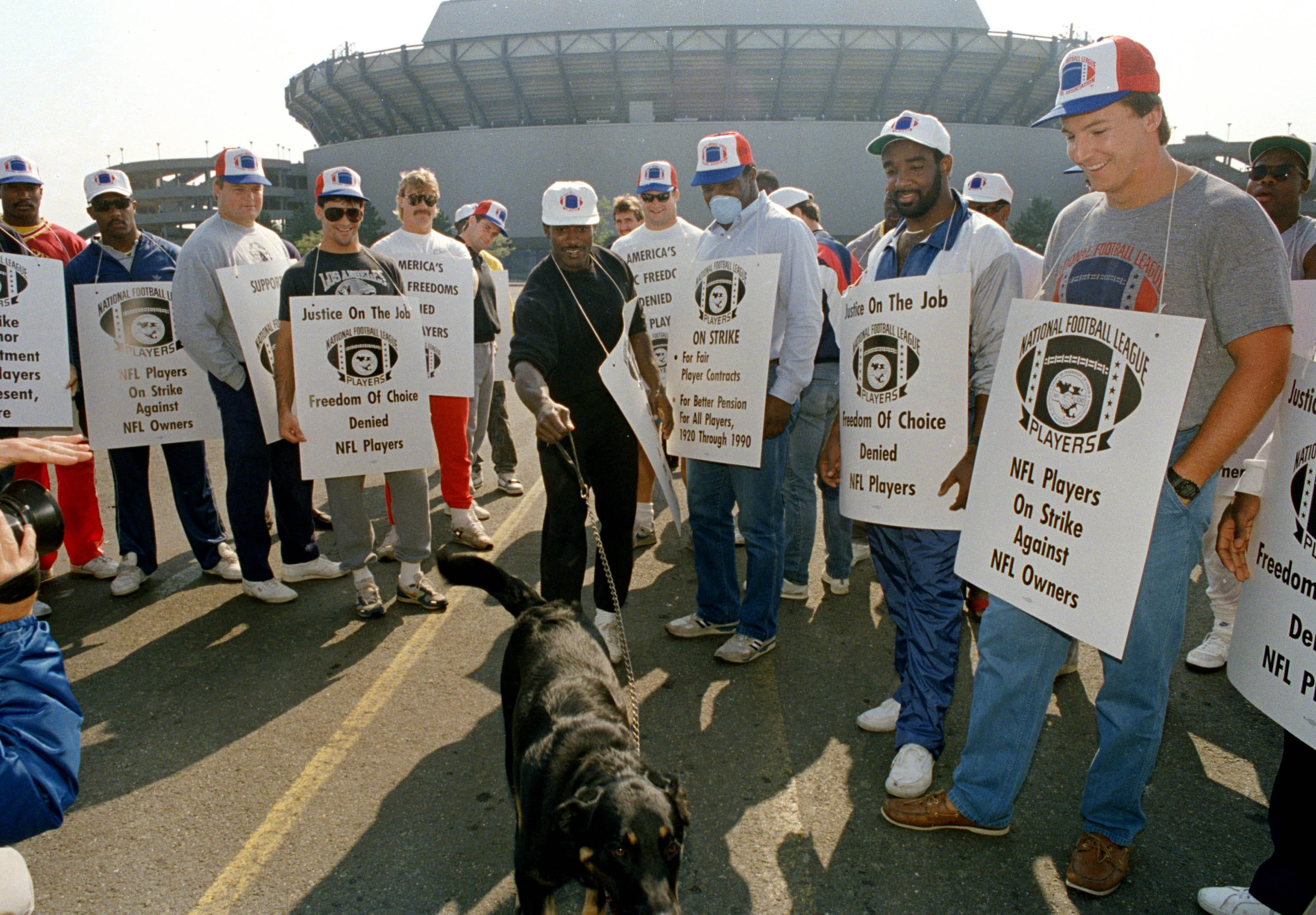New York Giants players stand in a picket line outside Giants Stadium during the NFL players strike in September 1987.