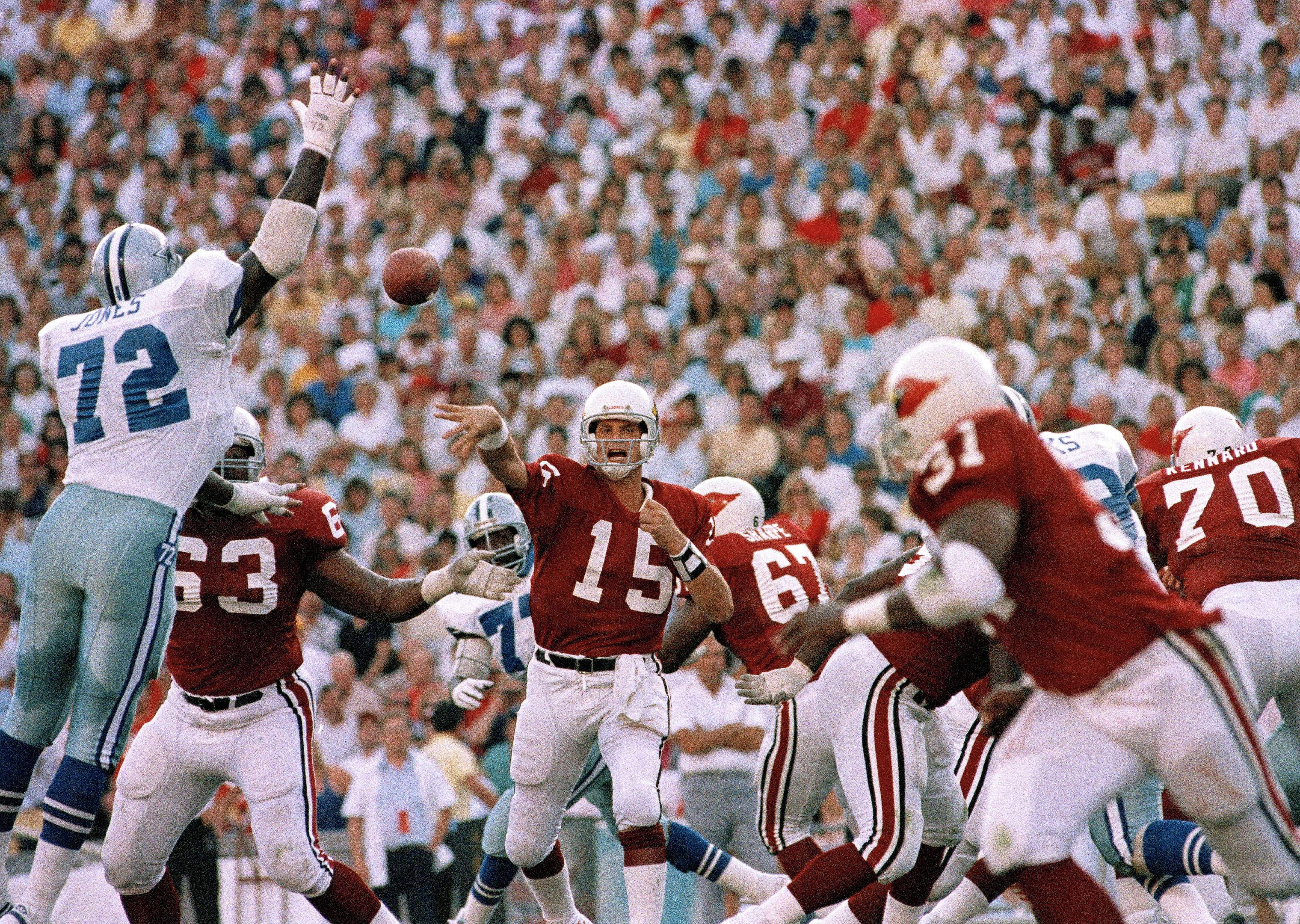 Phoenix Cardinals quarterback Neil Lomax throws a pass against the Dallas Cowboys in September 1988.