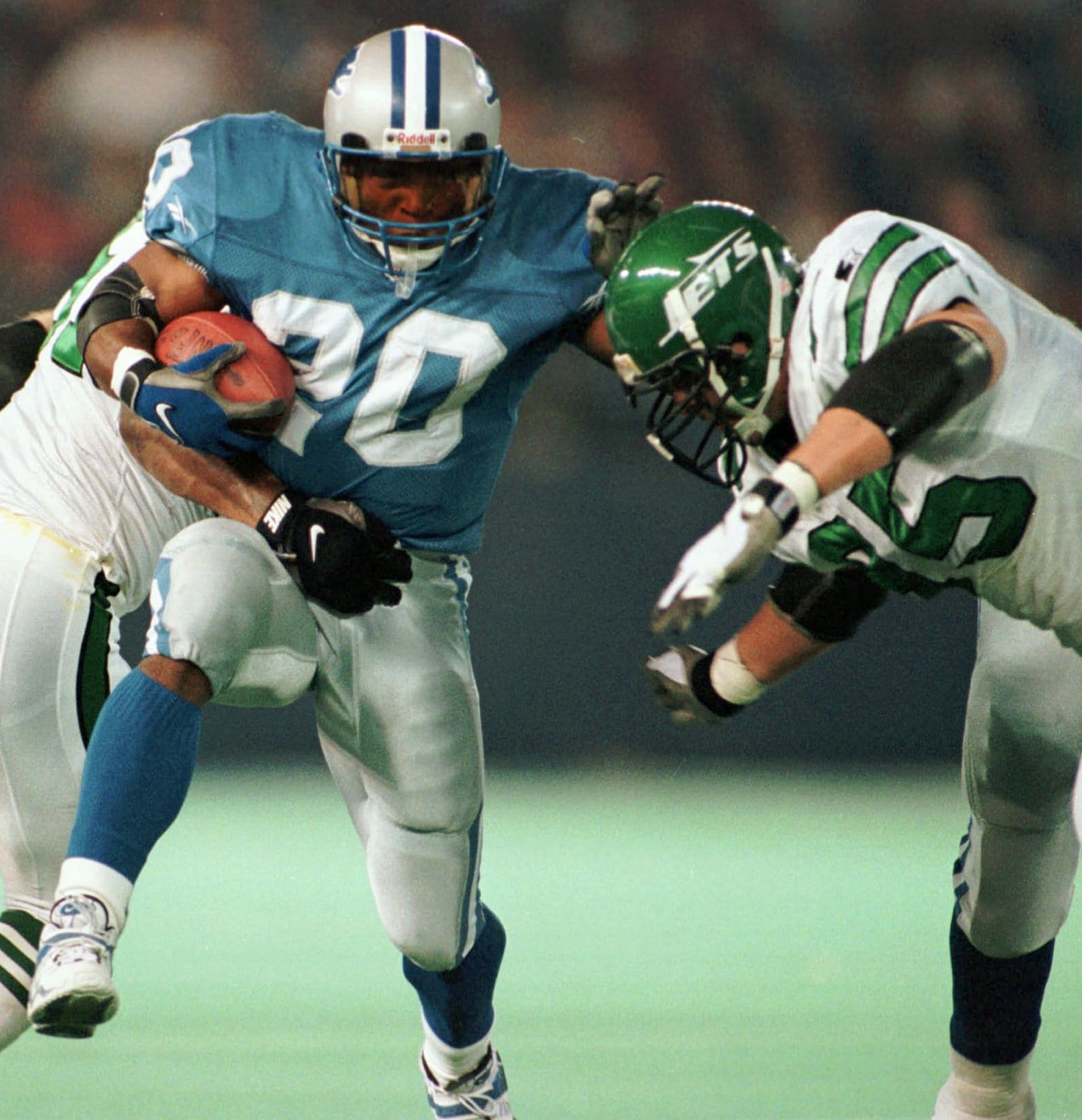 Detroit Lions running back Barry Sanders carries the ball during a game against the New York Jets in 1997.