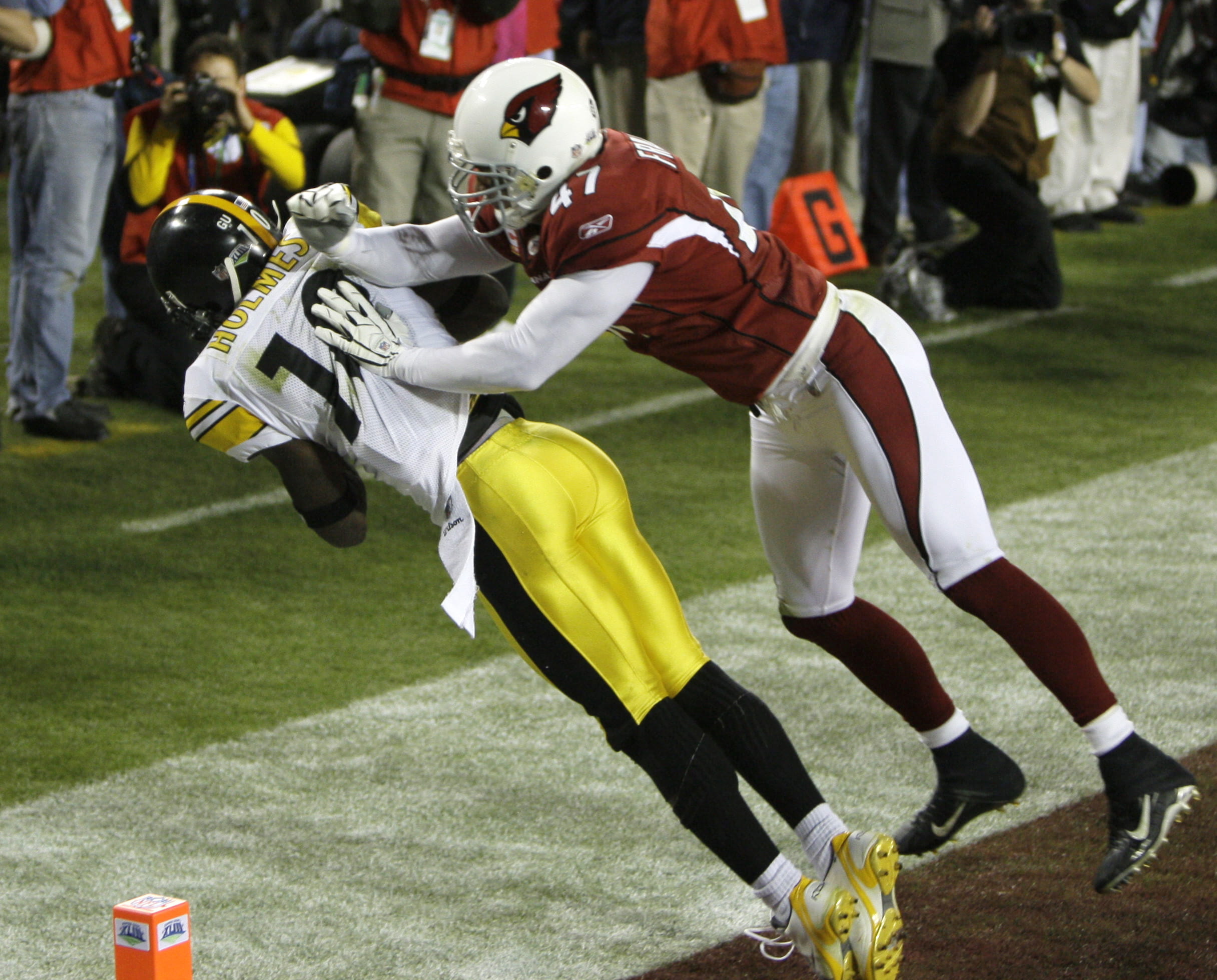Pittsburgh Steelers wide receiver Santonio Holmes makes a touchdown catch in front of Cardinals safety Aaron Francisco during the fourth quarter of Super Bowl XLIII.