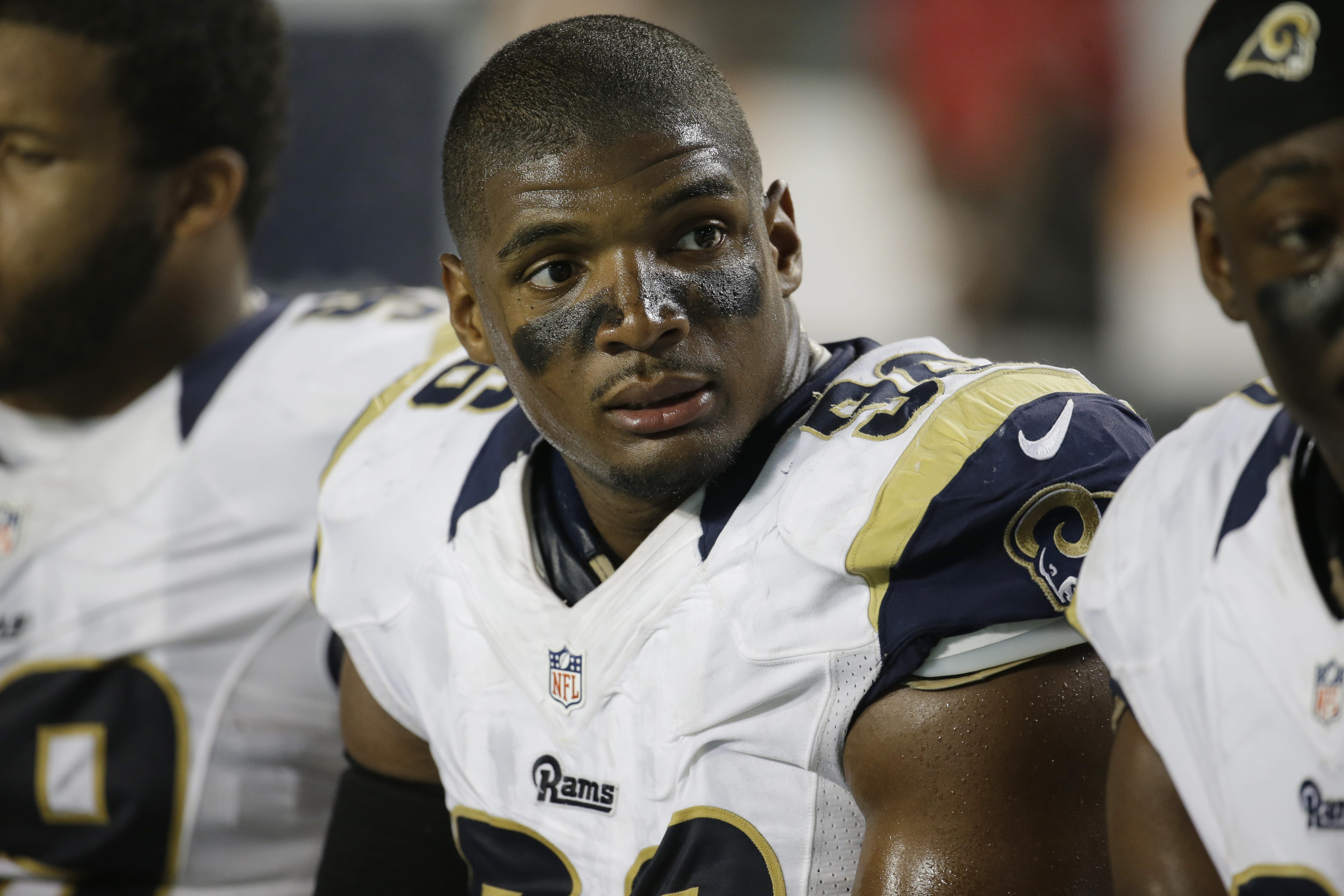 St. Louis Rams defensive end Michael Sam sits on the bench during a preseason game against the Miami Dolphins in August 2014.