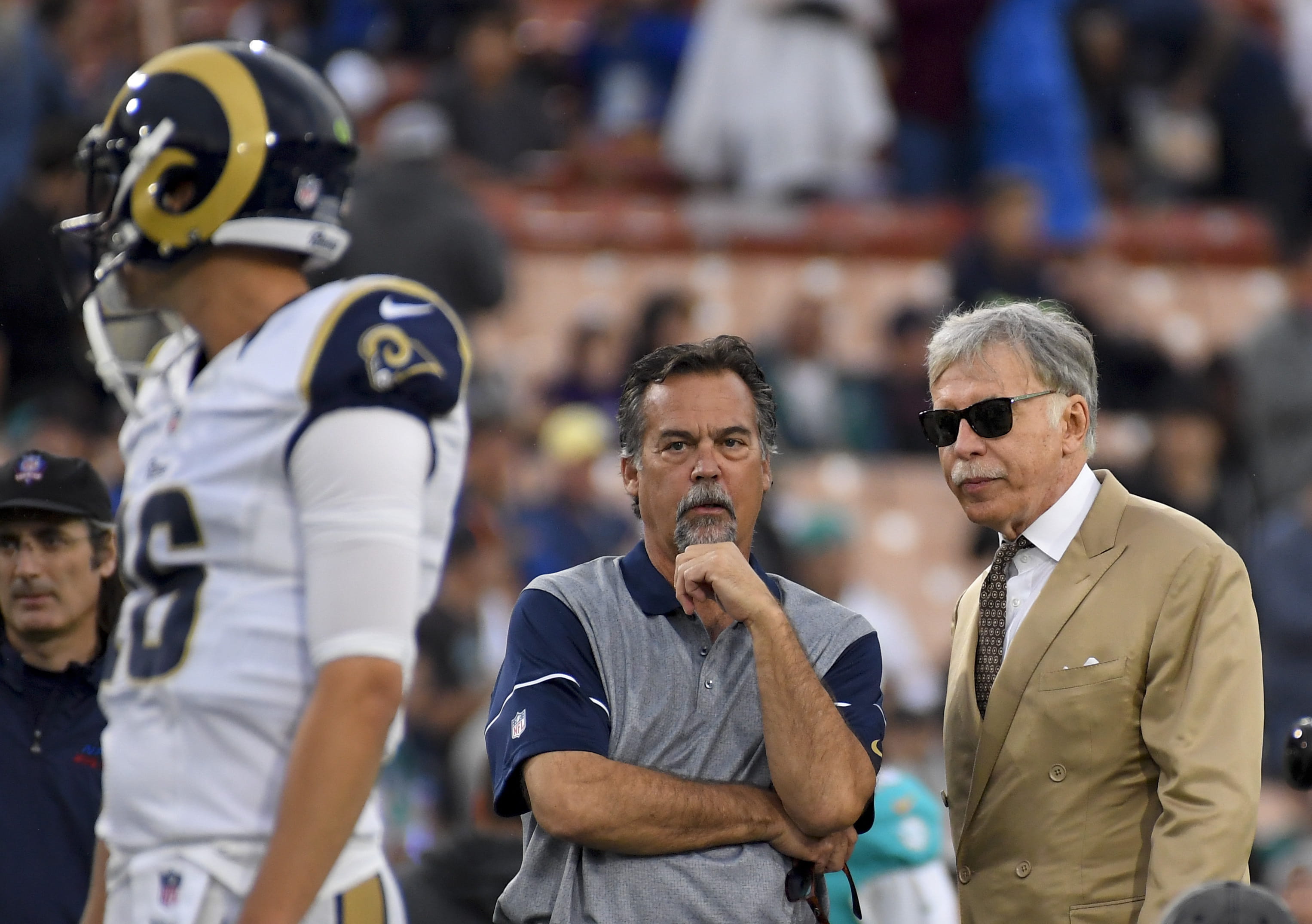 Rams coach Jeff Fisher, center, and team owner Stan Kroenke watch quarterback Jared Goff warm up before a game in 2016.