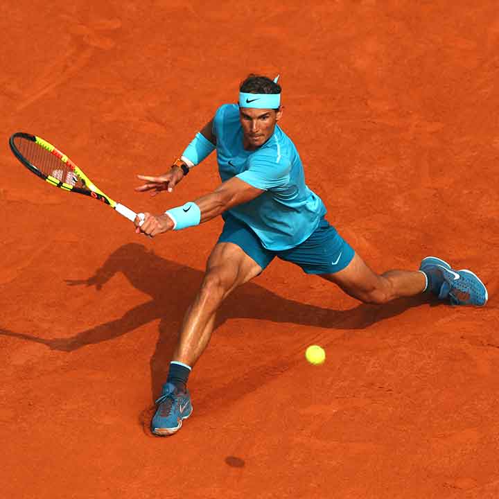 Rafael Nadal sliding on clay court