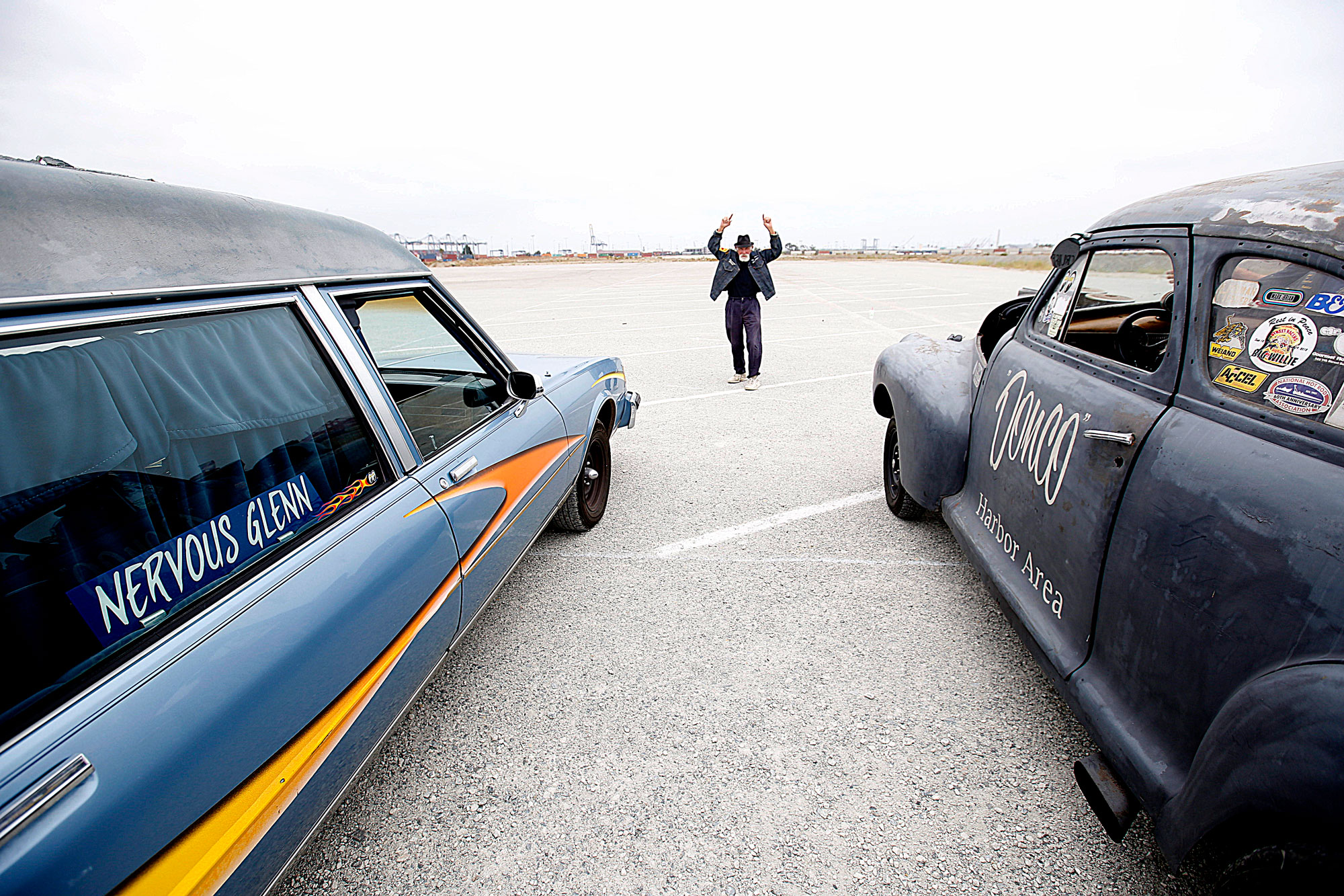 Two cars line up for a race at Terminal Island